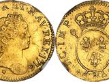 a gold sovereign coin with a crown on top of it