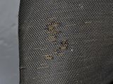 a close up of a piece of fabric with holes in it