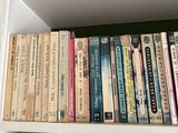 many books that are on a shelf in the room