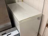 a refrigerator and a freezer in a small kitchen