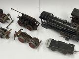 many different types of toy trains on a white surface