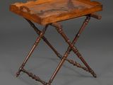 an antique wooden tray with a carved design on it