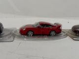 three toy cars that are sitting on top of each other