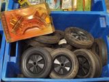 a blue bin filled with wheels and a box of books