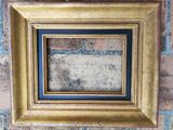 a picture of a picture frame hanging on a brick wall