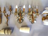 many different types of wall sconces on the table