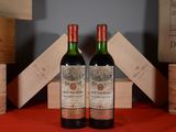 two bottles of wine sitting next to each other on a table