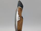 a pen that has a wooden handle on it