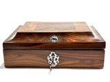 a wooden box with a lock on it on a white surface