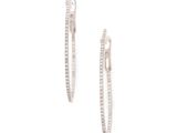 a pair of diamond hoop earrings on a white background