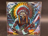 an image of a picture of a man with a headdress playing an electric guitar