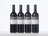 three bottles of red wine are lined up on a table
