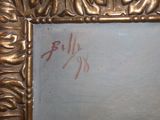 a picture of a gold frame with a painting on it