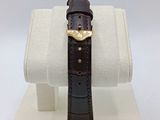 an image of a watch on display on a white display stand