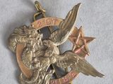 une image représentant une médaille d'or sur laquelle figurent un oiseau et une étoile