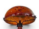 an image of a table lamp with an orange glass shade