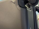 a close up of a piece of luggage with a handle on it