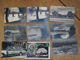 several black and white photos of old buildings on a wooden table