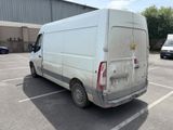 a white van that is parked in a parking lot