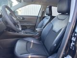 the interior of a car with black leather seats and a steering wheel