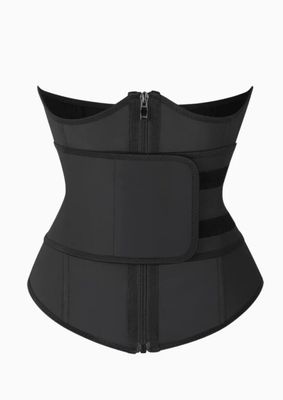 a woman wearing a black corset with zippers on it