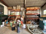 a room with a lot of items and tools on the floor