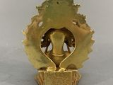 brass figurine of an elephant with a crown on it ' s head