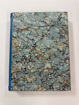 blue and gold marbled notebook with a blue cover