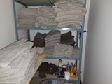 a bunk bed with a lot of towels on top of it