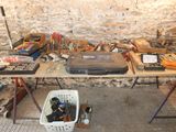 a table with many tools on it in a room