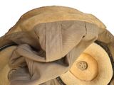 a hat that is sitting on top of a bag