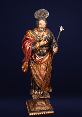 an image of a statue of a man holding a staff