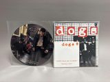a cd with a picture of a group of people on it