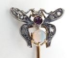 a close up of a stick with a bee on it