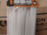 a bunch of white plastic cable ties in a box