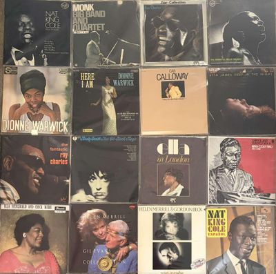 a lot of records on the wall of a room