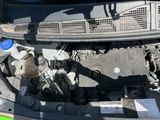 a picture of a car engine with its hood open