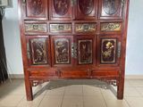 a wooden cabinet with many doors on it