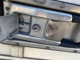 a close up of a metal door handle on a truck