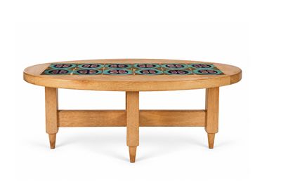an image of a wooden table with a blue and green design on it