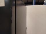 an image of a bathroom with a toilet and a shower stall