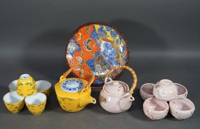 many different types of teapots and cups on the table