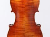 an old violin with a wooden back and a long neck