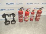 a group of fire extinguisors sitting on top of a table