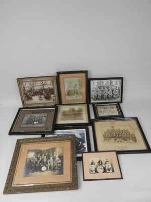 an assortment of framed photographs and framed pictures on a white surface