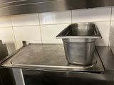 a stainless steel pan on top of a stove