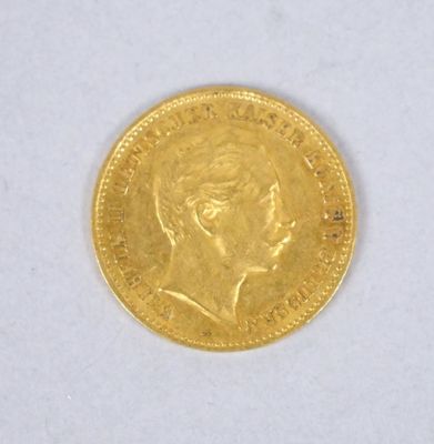 l'image d'une pièce d'or sur laquelle figure le visage d'une femme