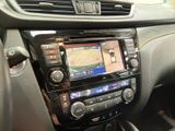 the dashboard of a car with a gps device in the center of it