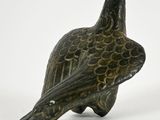 a small bird that is sitting on top of a table