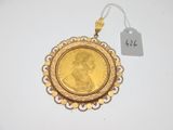 une image représentant une pièce d'or sur laquelle figure le portrait d'une femme